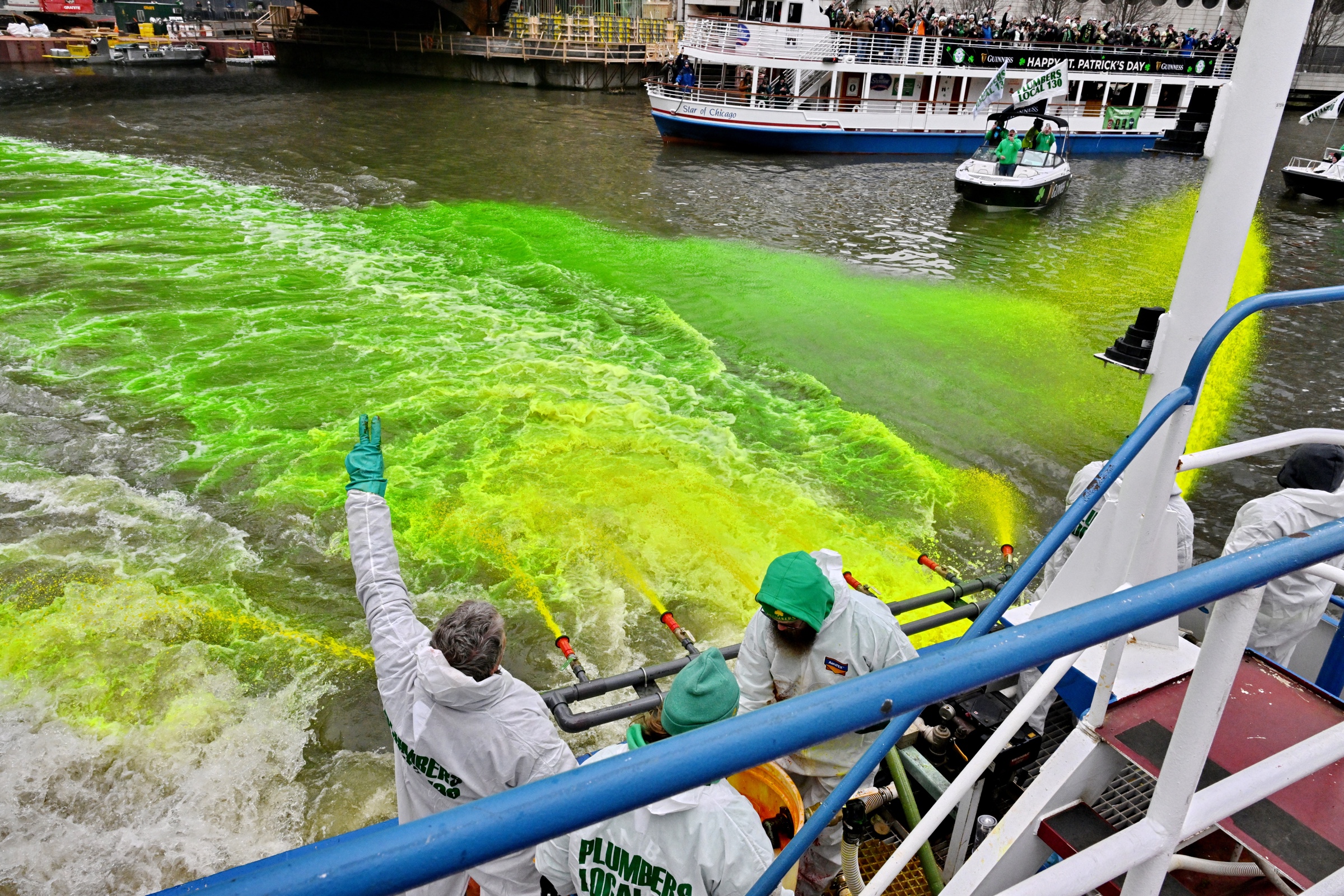 The working crew aboard a boat during Chicago’s river-dyeing tradition