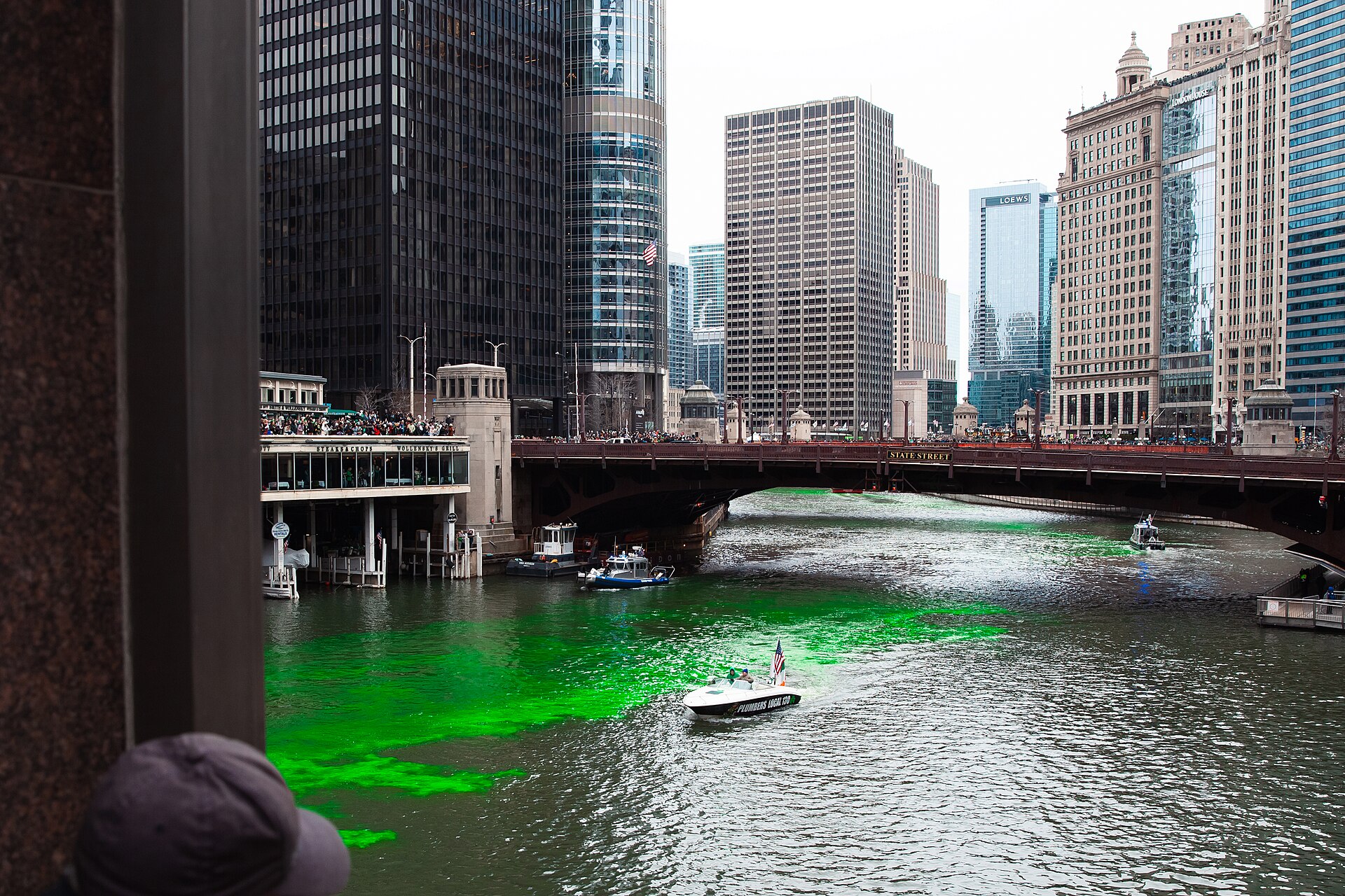 A Plumbers Local 130 boat on the green Chicago River in 2026